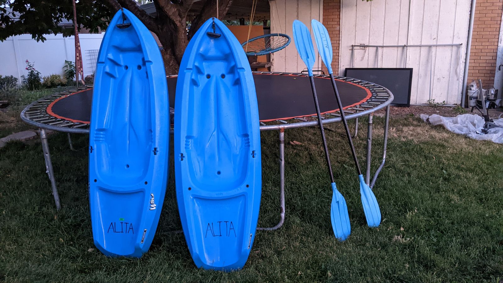 (2) Lifetime youth kayaks with paddles for riders up to 130 pounds.