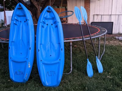 (2) Lifetime youth kayaks with paddles for riders up to 130 pounds.