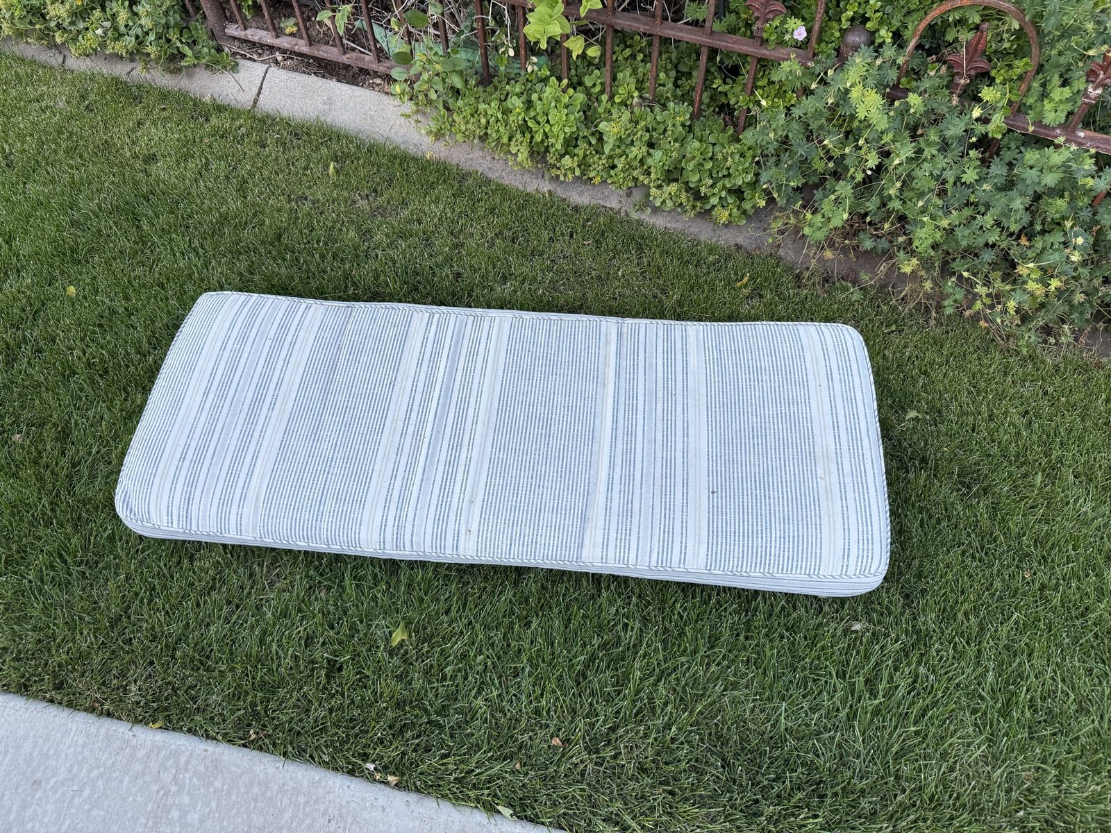 Long striped bench cushion 46 X 18 does have some marks on back.