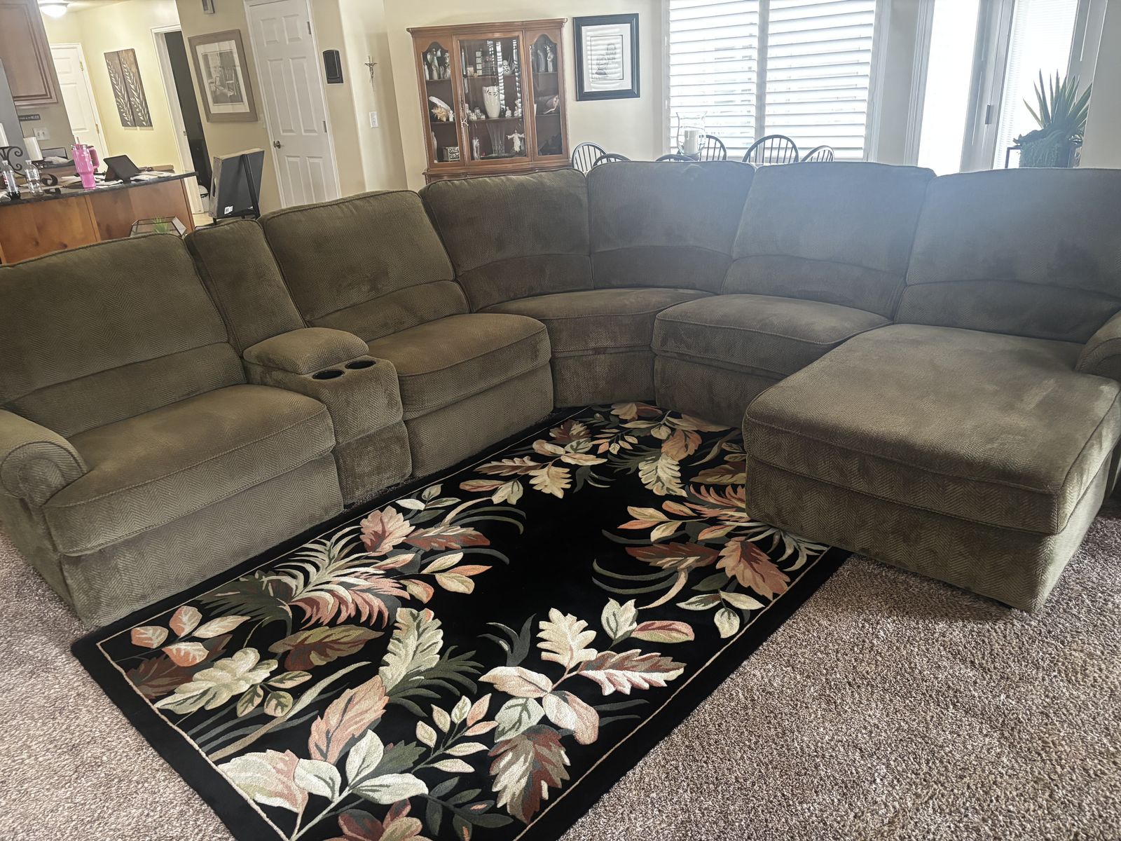 Sectional couch with recliner ends and chaise.