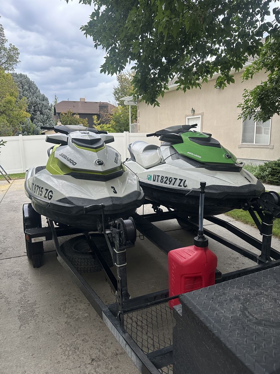 Pair of Sea-Doo GTI 130 Personal Watercraft with Double Trailer