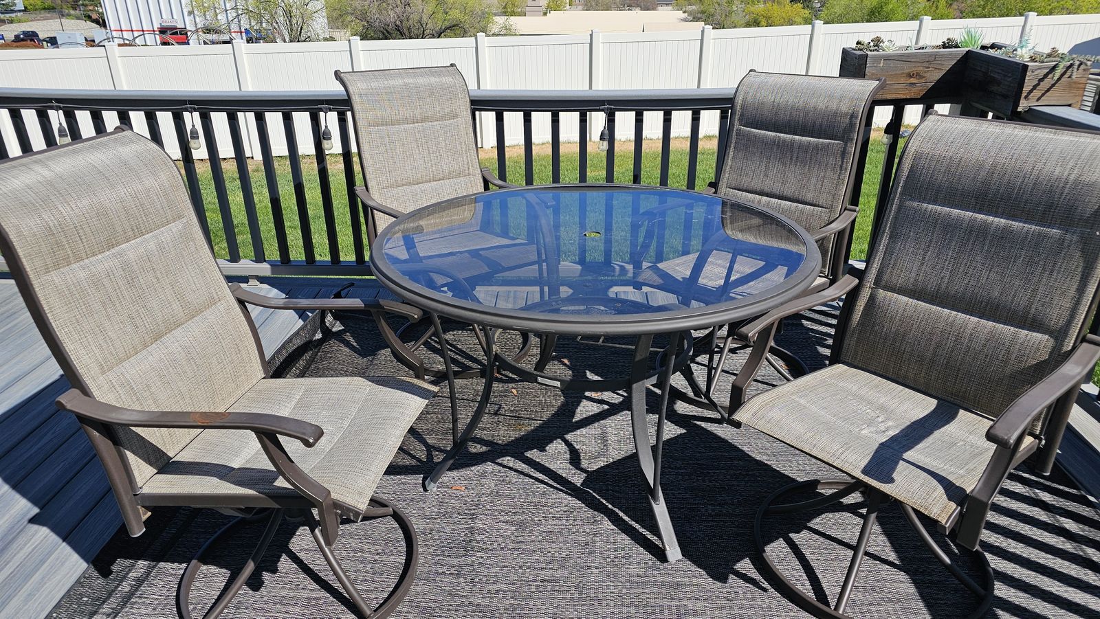 wrought iron/glass  48" round table and 4 wrought iron chairs