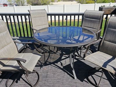 wrought iron/glass 48" round table and 4 wrought iron chairs