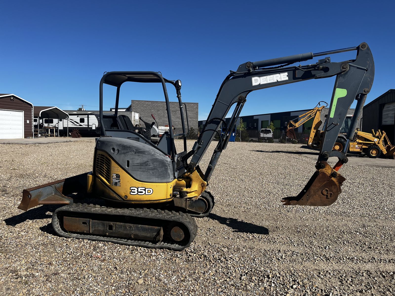 2005 John Deere Mini Ex and 2006 Big Tex Trailer