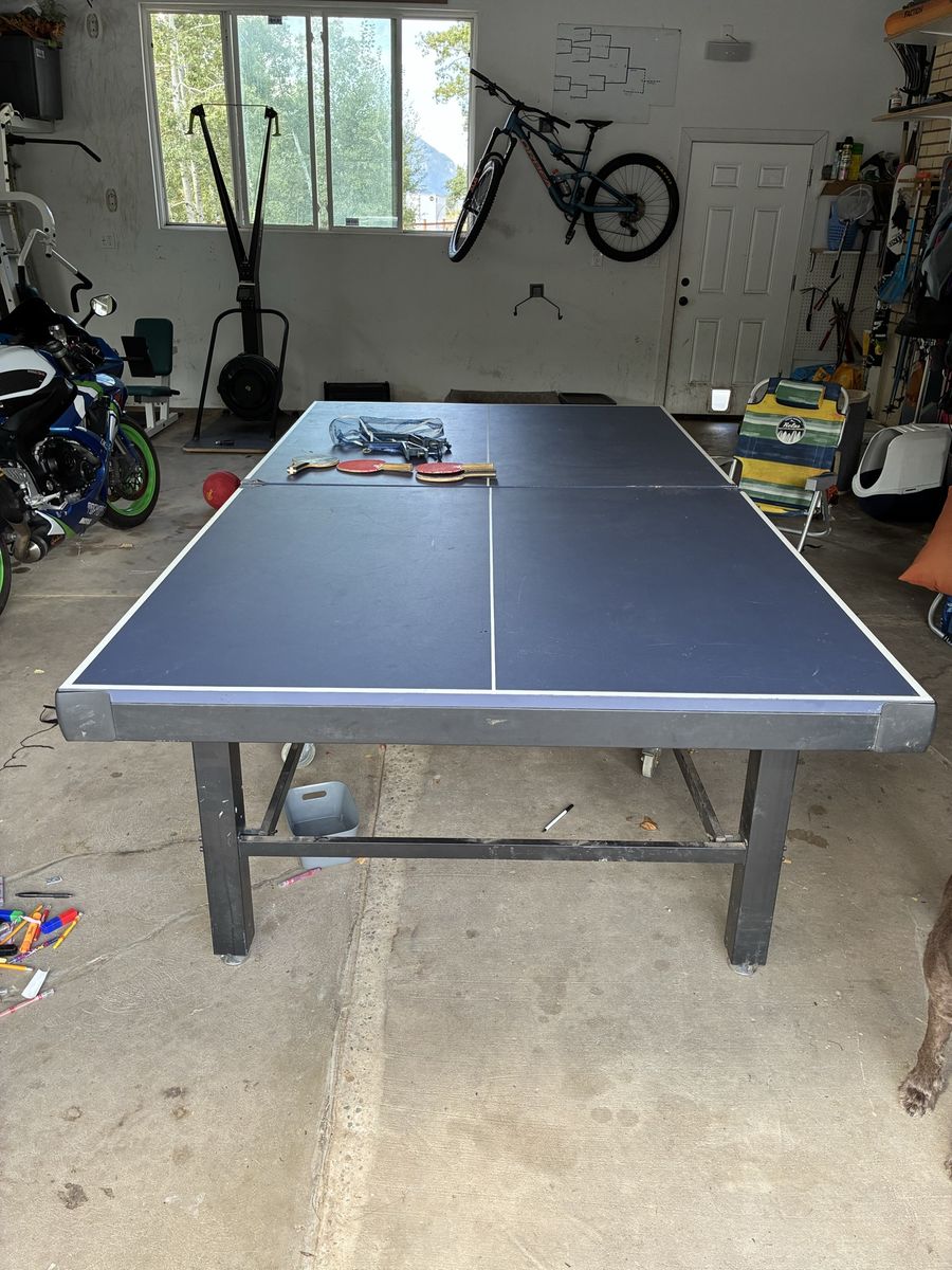 Sturdy Blue Indoor/Outdoor Ping Pong Table with Paddles.