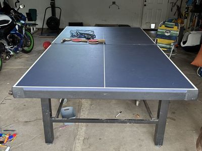 Sturdy Blue Indoor/Outdoor Ping Pong Table with Paddles.