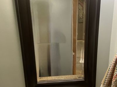Bathroom, vanity, countertop, faucet, sink, and mirror