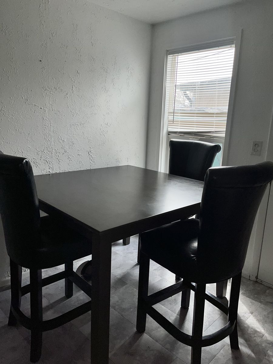 Table and three chairs