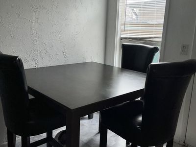 Table and three chairs