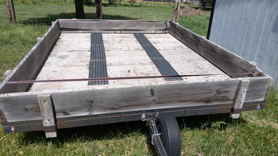 Utility Trailer with Wooden Stake Sides and Metal Frame