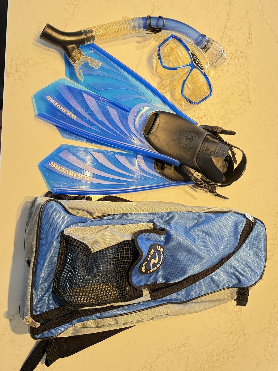 2 sets of US Divers mask, snorkel, and fins with backpacks