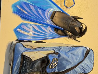 2 sets of US Divers mask, snorkel, and fins with backpacks