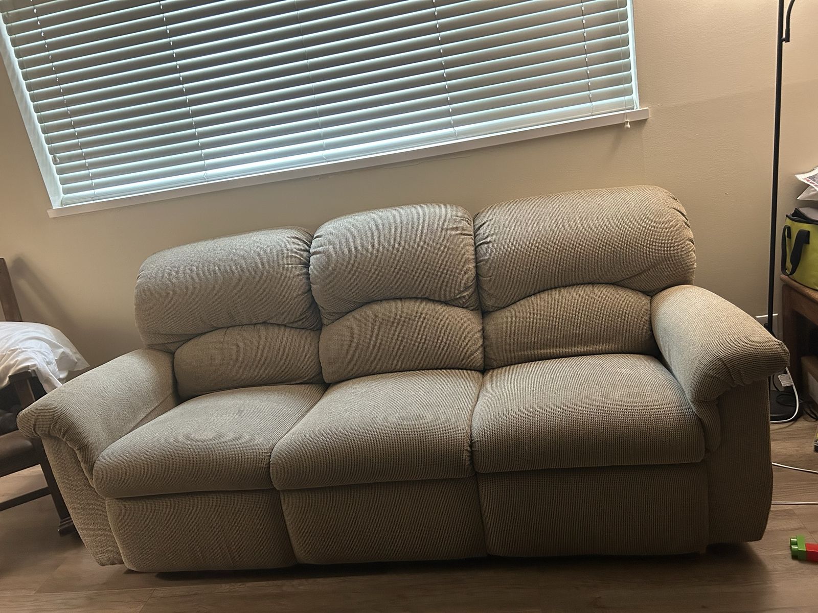 Beige lazy boy reclining couch and loveseat set
