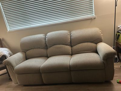 Beige lazy boy reclining couch and loveseat set