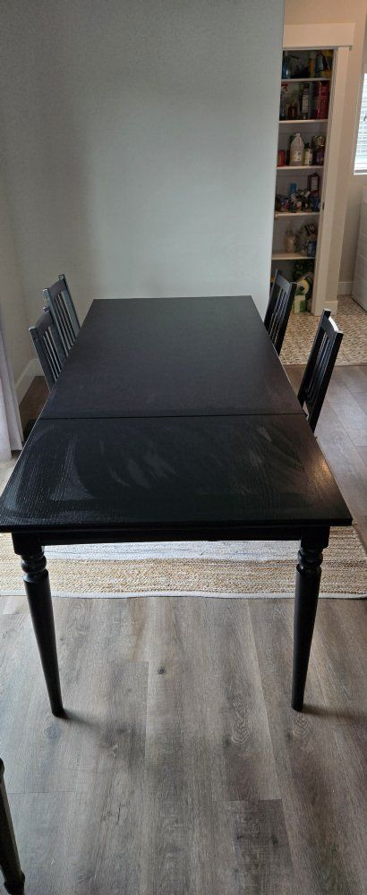 Table with leaf and 4 chairs