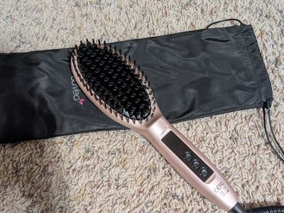 Heated straightening brush