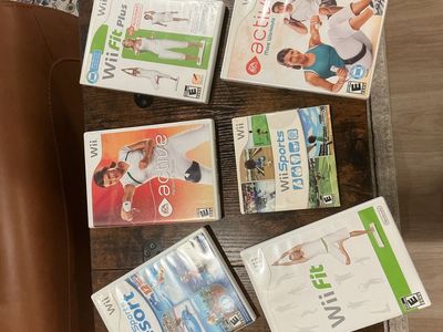 Wii Console Bundle with 6 Games, 2 Controllers, Nunchucks, and Accessories including Balance Board (not shown)