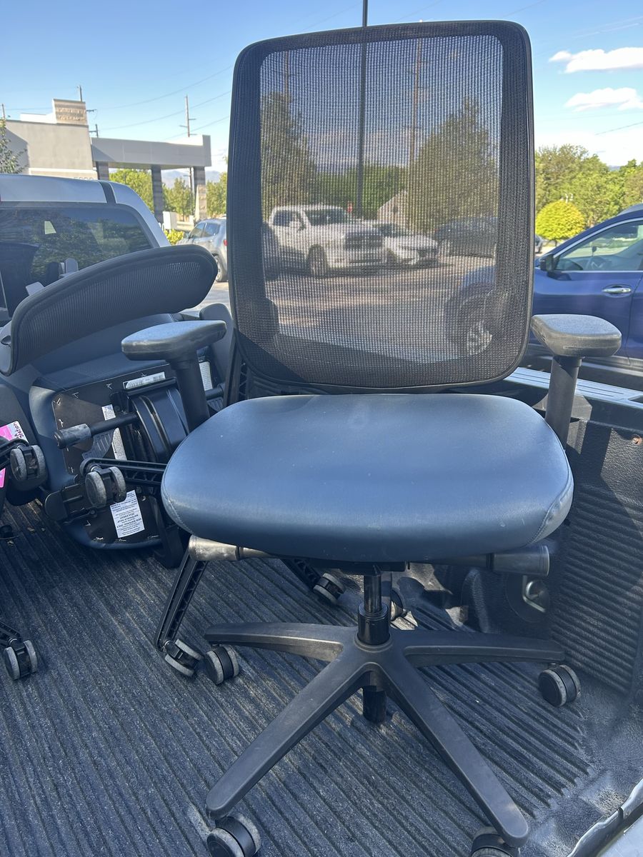 5 blue/black office chairs