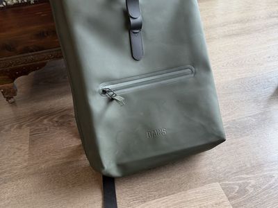 RAINS Green Rolltop Water-Resistant Backpack - Sleek & Durable