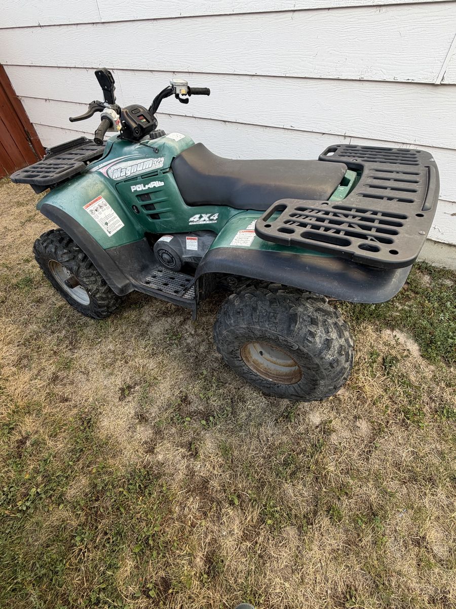 Polaris magnum 325 4x4 with snow plow 