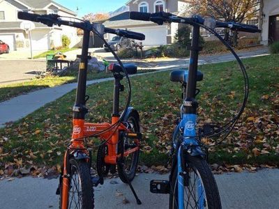 Zizzo Via 20" Folding Bikes - Orange & Blue Pair, 7-Speed Commuter