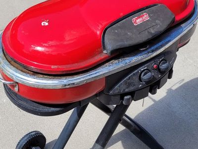 Coleman RoadTrip NXT 200 Red Propane Grill with Wheels - Portable & Ready for Adventure!