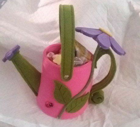Cute Felt Watering Can Gift Baskets -filled with snacks and a sparkling bracelet.