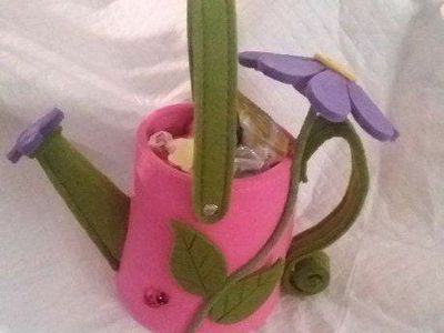 Cute Felt Watering Can Gift Baskets -filled with snacks and a sparkling bracelet.