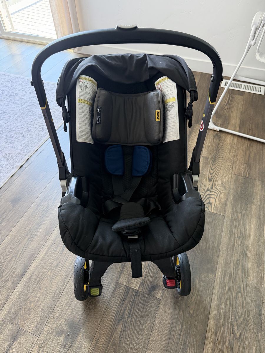 Doona Infant Car Seat and Stroller Combo with Vehicle Seat Protector. Two car bases