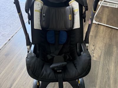Doona Infant Car Seat and Stroller Combo with Vehicle Seat Protector. Two car bases
