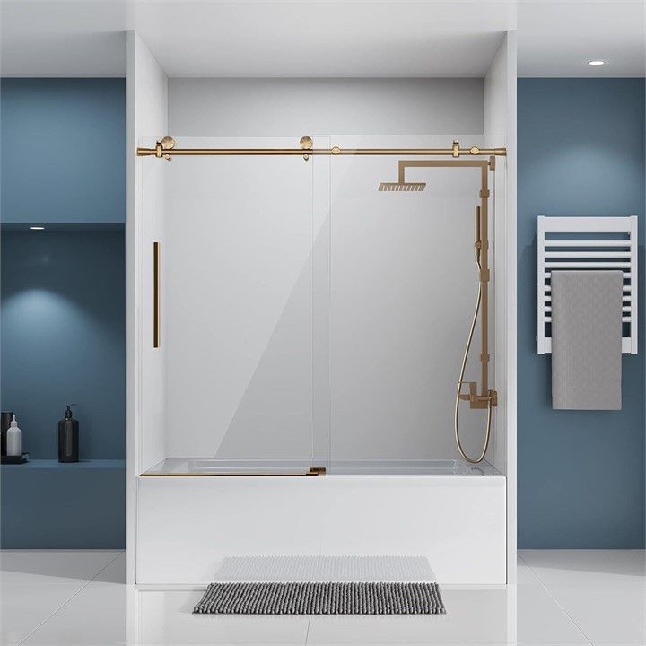 Frameless Sliding Glass Tub Door with Brushed Brass Hardware and Anti-Splash Threshold