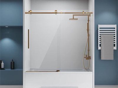 Frameless Sliding Glass Tub Door with Brushed Brass Hardware and Anti-Splash Threshold
