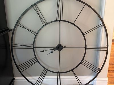 Large black metal wall clock