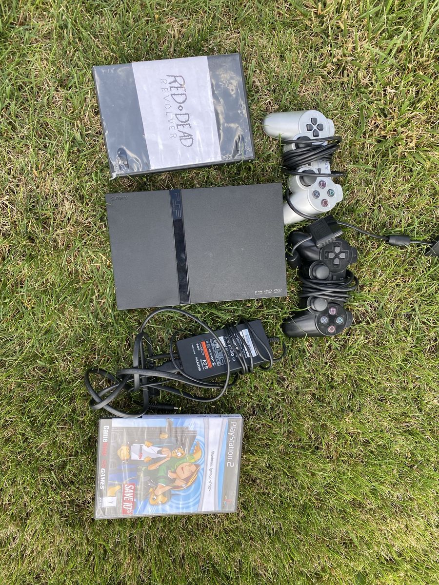 PlayStation 2 with games and controller
