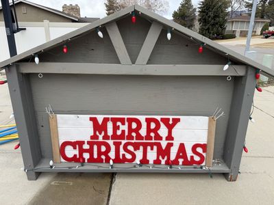 Merry Christmas Sign With Stable Backdrop