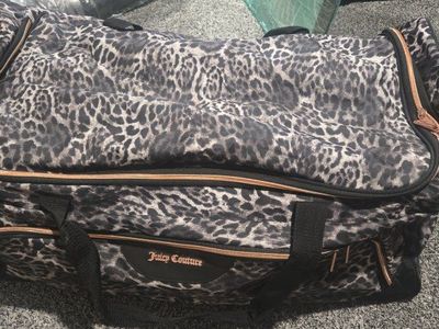 Juicy Couture Leopard Print Rolling Duffle Bag Luggage