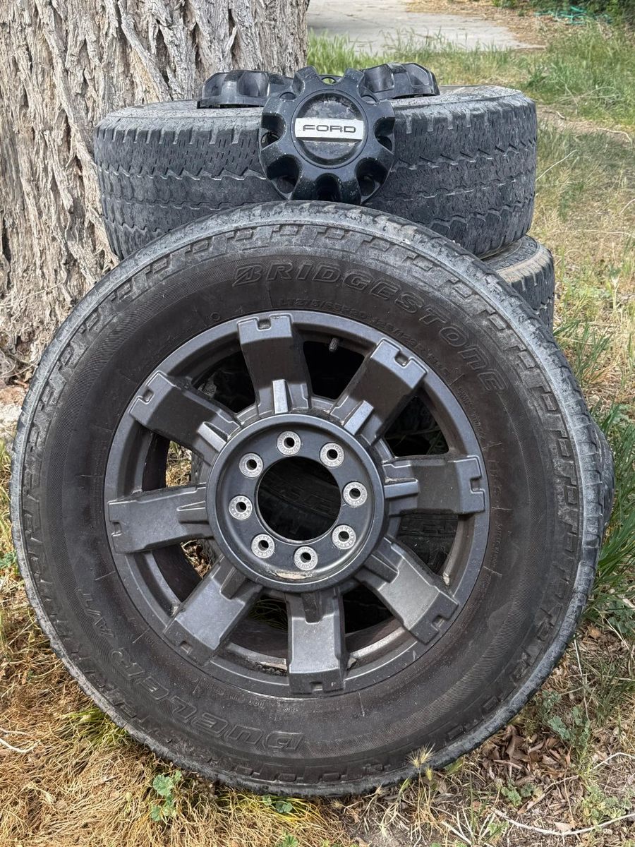 20" Dark Carbonized Gray Aluminum Sport Wheel (OEM Part Number 10485)paired with used LT275/65R20 Bridgestone Dueler A/T tires