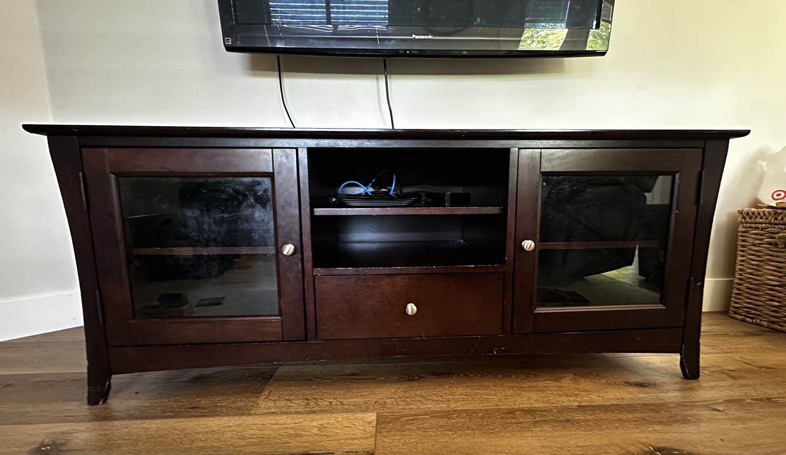 Dark wood tv stand with glass doors