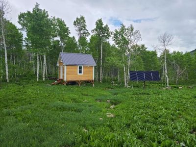 16x10 Tiny Home / Cabin - Solar Powered, Cedar Siding, Finished Interior with Shower & Lofts