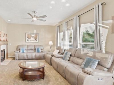 Excellent condition-Taupe Reclining Sofa, Loveseat & Recliner Set Light. Power Recline. Coffee table included!
