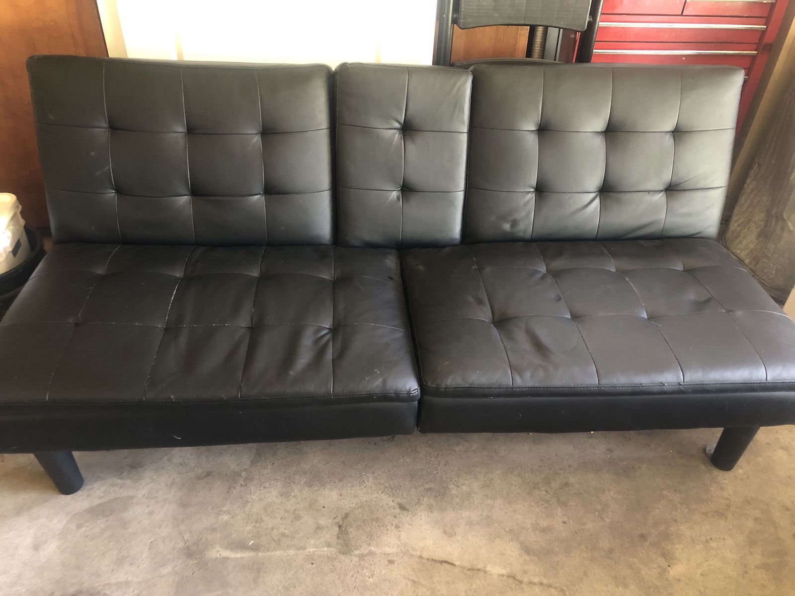 Black Faux Leather Futon Sofa Bed with Cupholders - Versatile Seating & Sleeping Solution