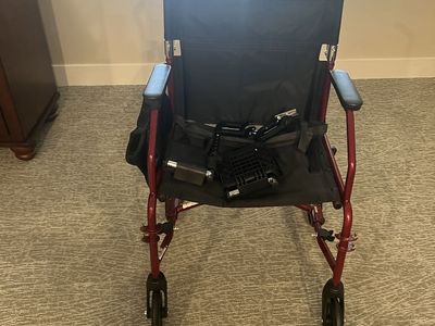 Red Lightweight Transport Wheelchair with Footrests and Storage Pouch