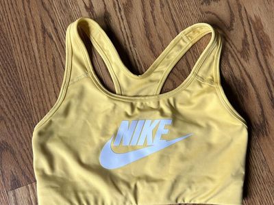 Nike Dri-Fit Women's Yellow Sports Bra with Large White Swoosh Logo - Racerback, No Removable Pads