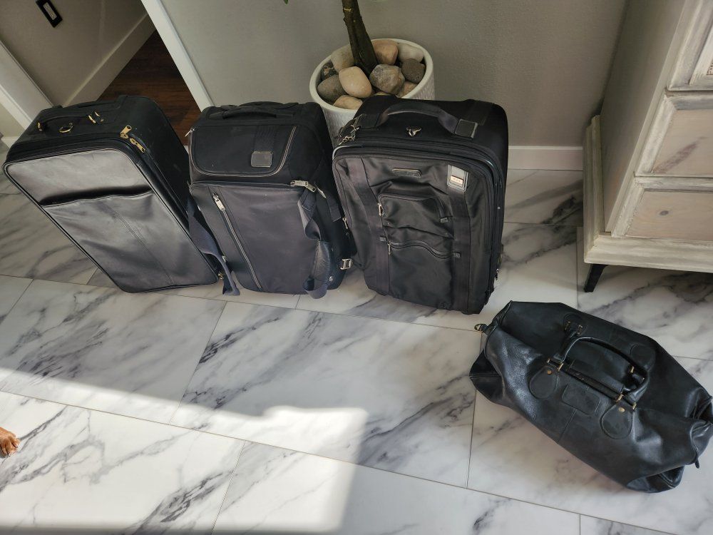 Tumi and Coach luggage carry on size
