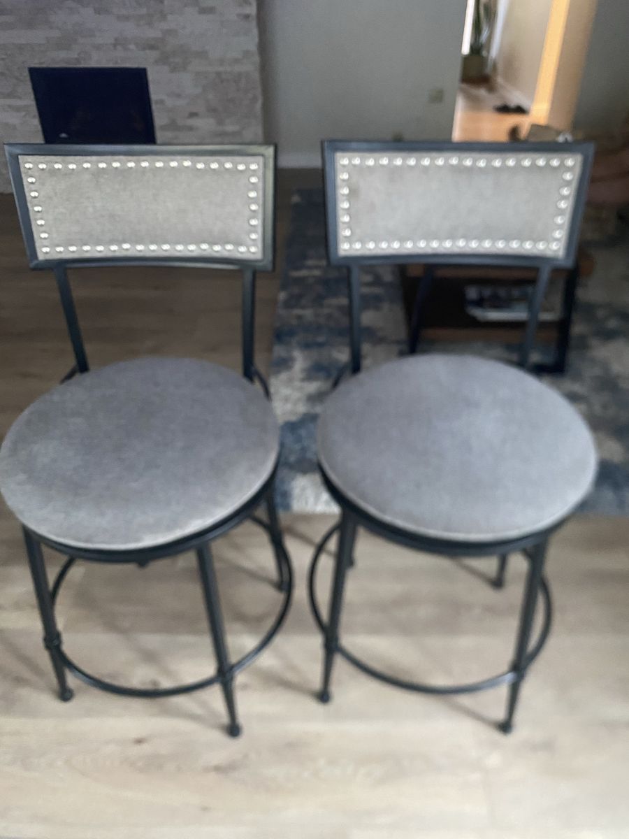 Metal barstools with grey upholstery