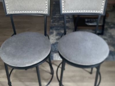 Metal barstools with grey upholstery