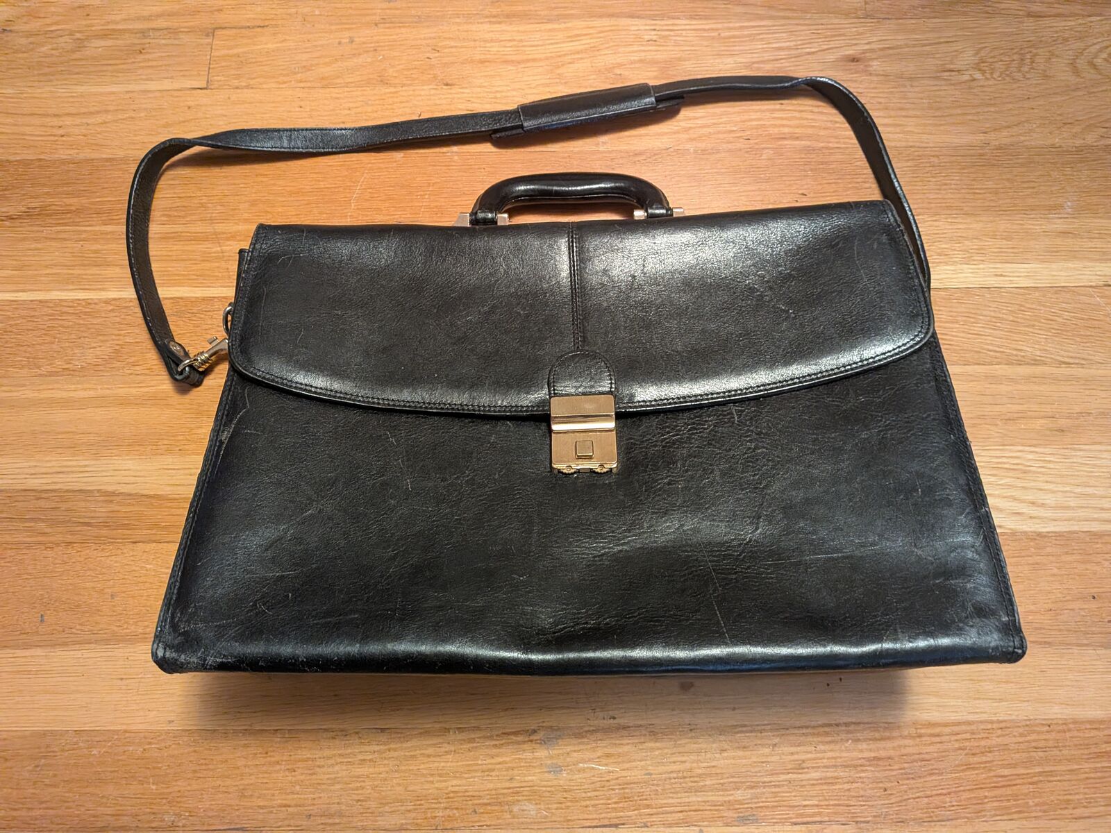 Amiet brand attaché case in black leather. 20" x 12".