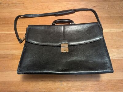 Amiet brand attaché case in black leather. 20" x 12".