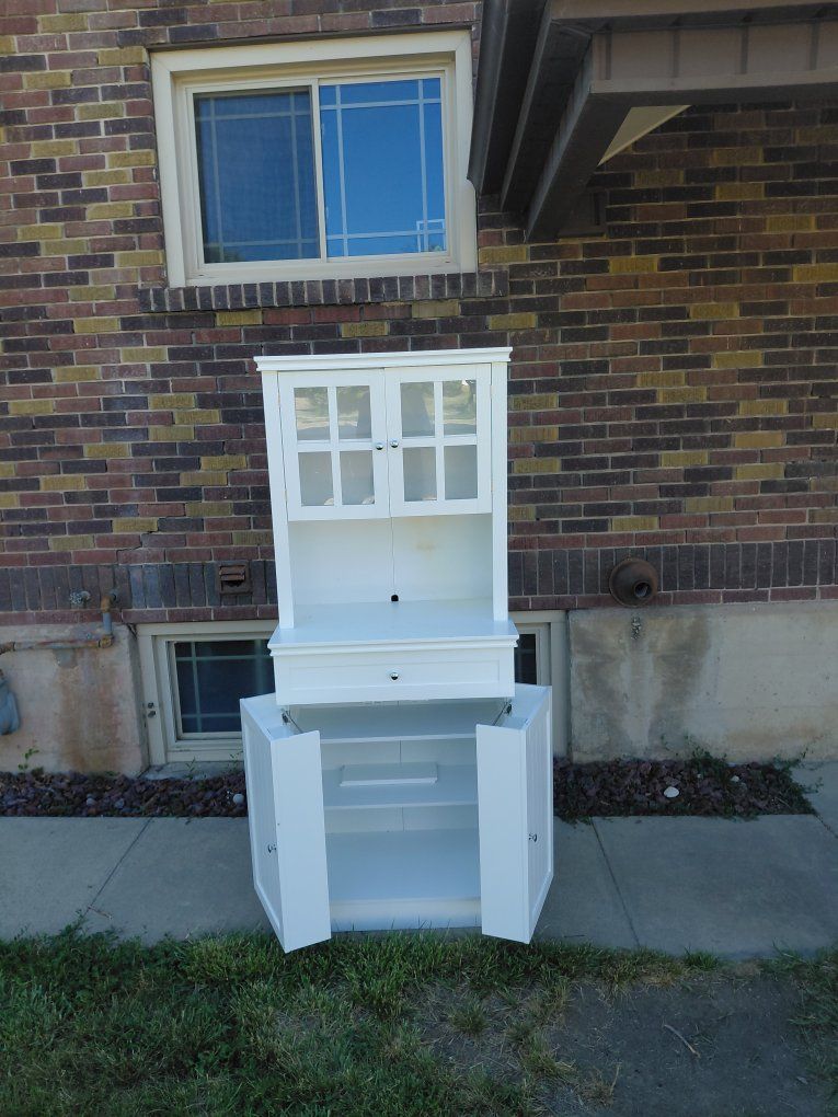 White cabinet with folding shelves.