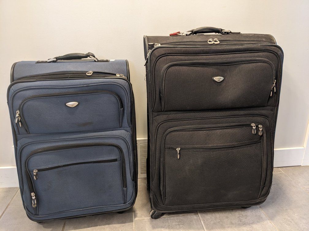Dockers Expandable Rolling Suitcase - Carry-On and Checked size with Multiple Compartments